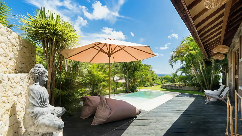 Private pool terrace with Buddha statue and ocean view