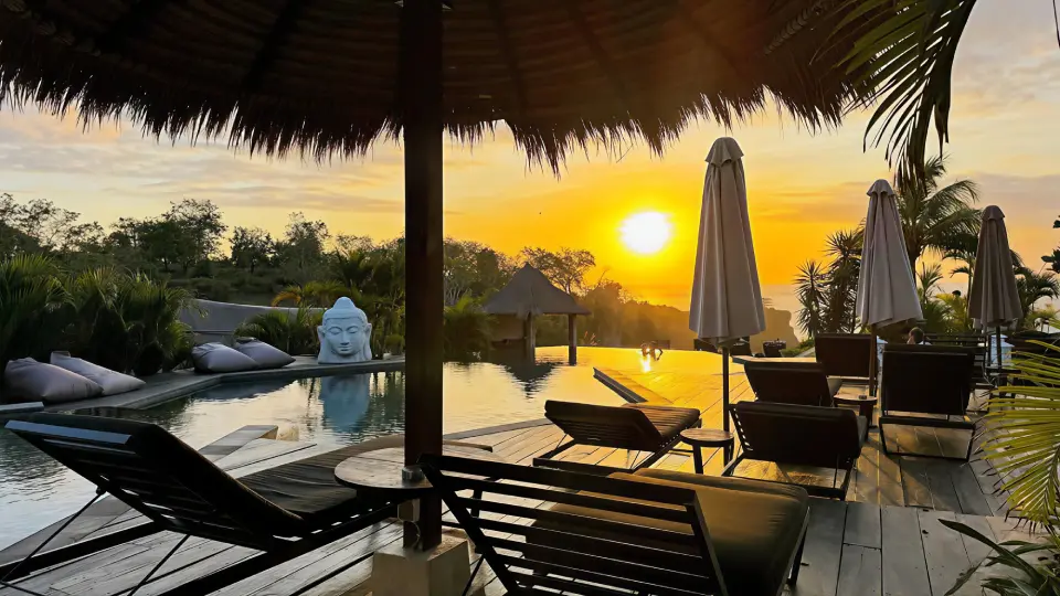 Sunset pool lounge with loungers overlooking the ocean